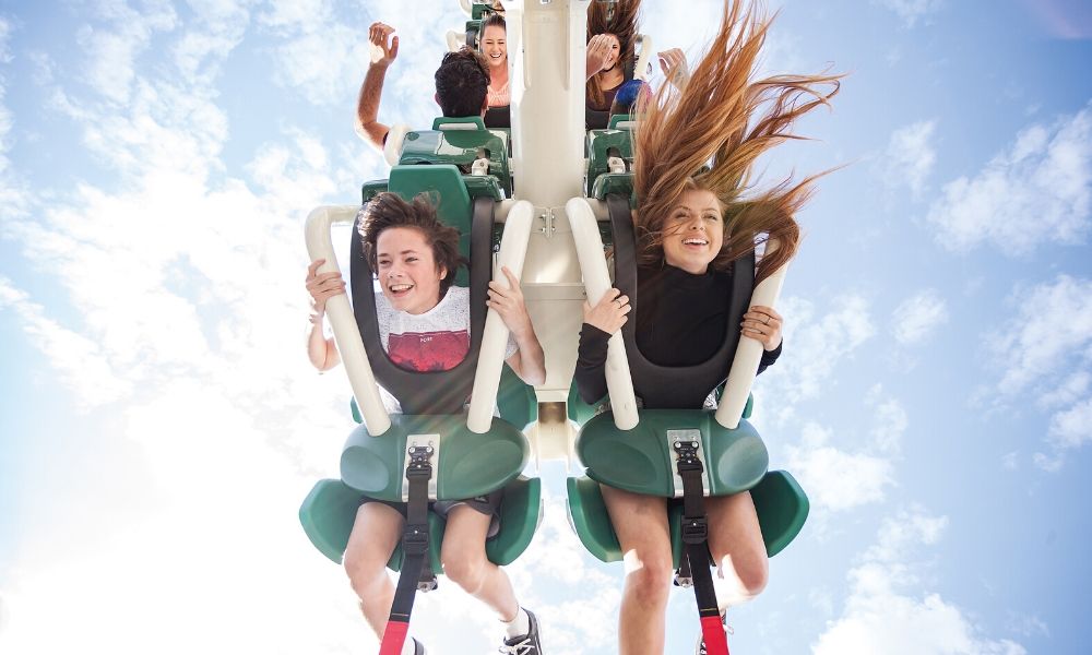 People cheering on Super Villains Ride Movie World