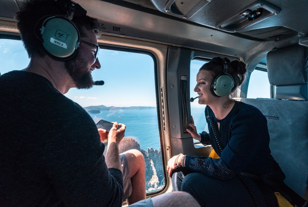 Couple in Helicopter looking out the window