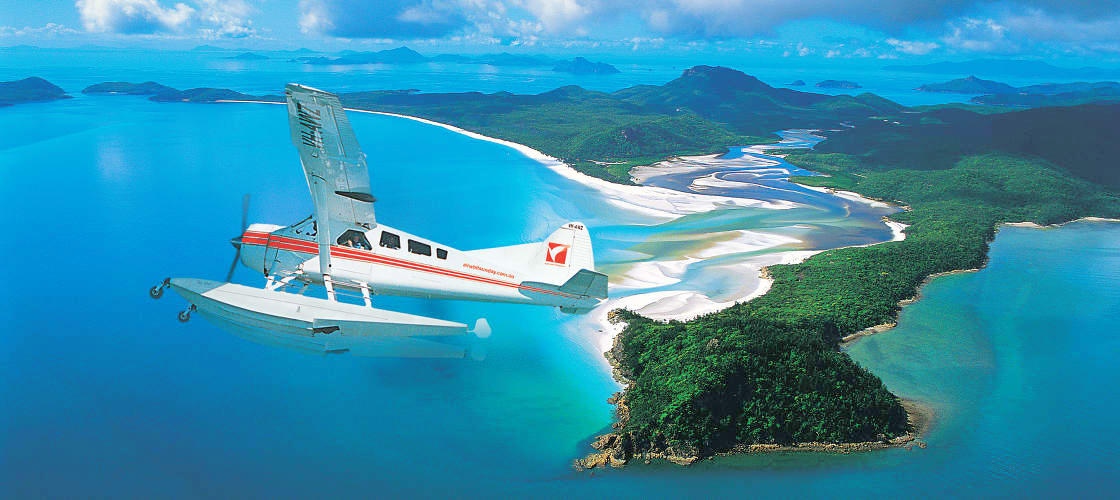 Sea plane flying over the Whitsundays