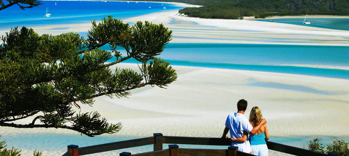 Couple overlooking sand cays of Whitsundays