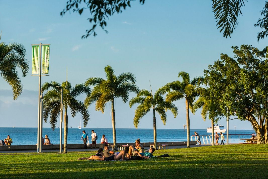 Locals enjoying Cairns esplanade at sunset
