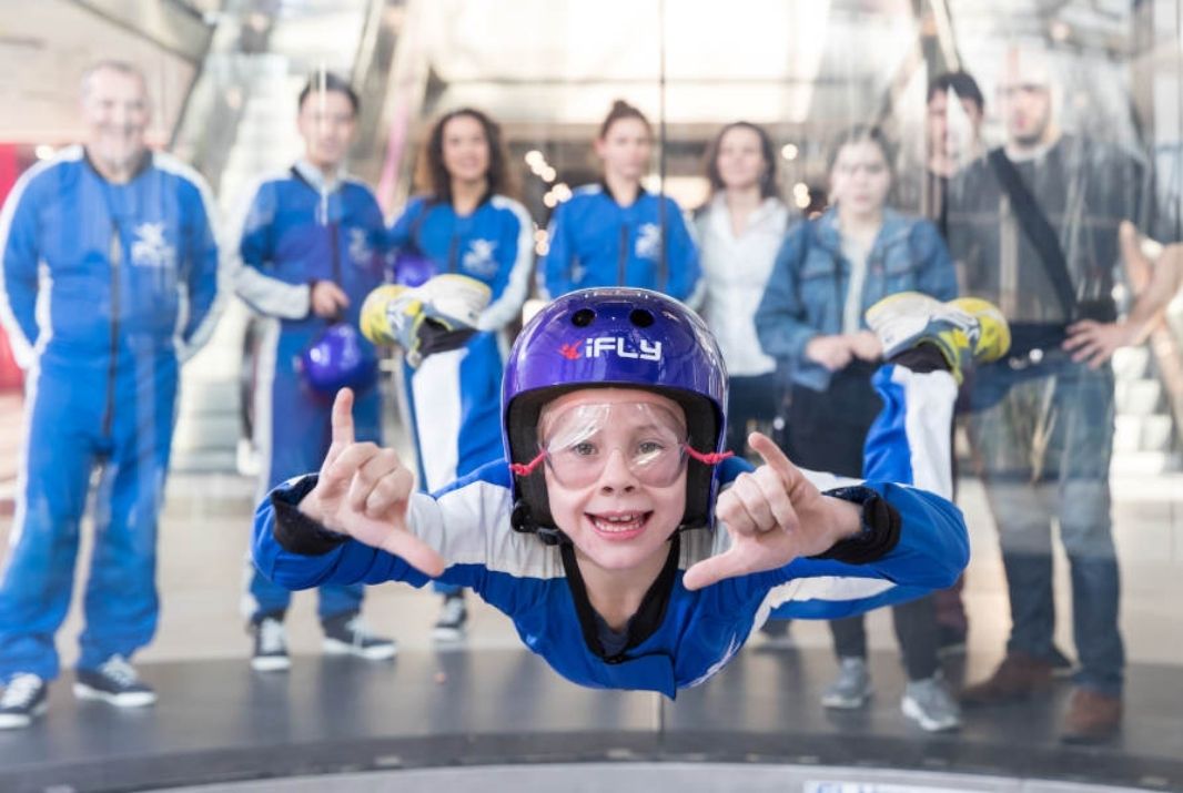 Child doing shaka while indoor skydiving at iFly Perth