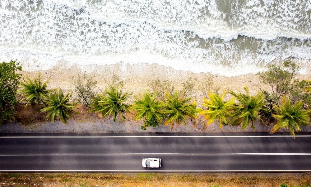 Car on roadtrip along coastline