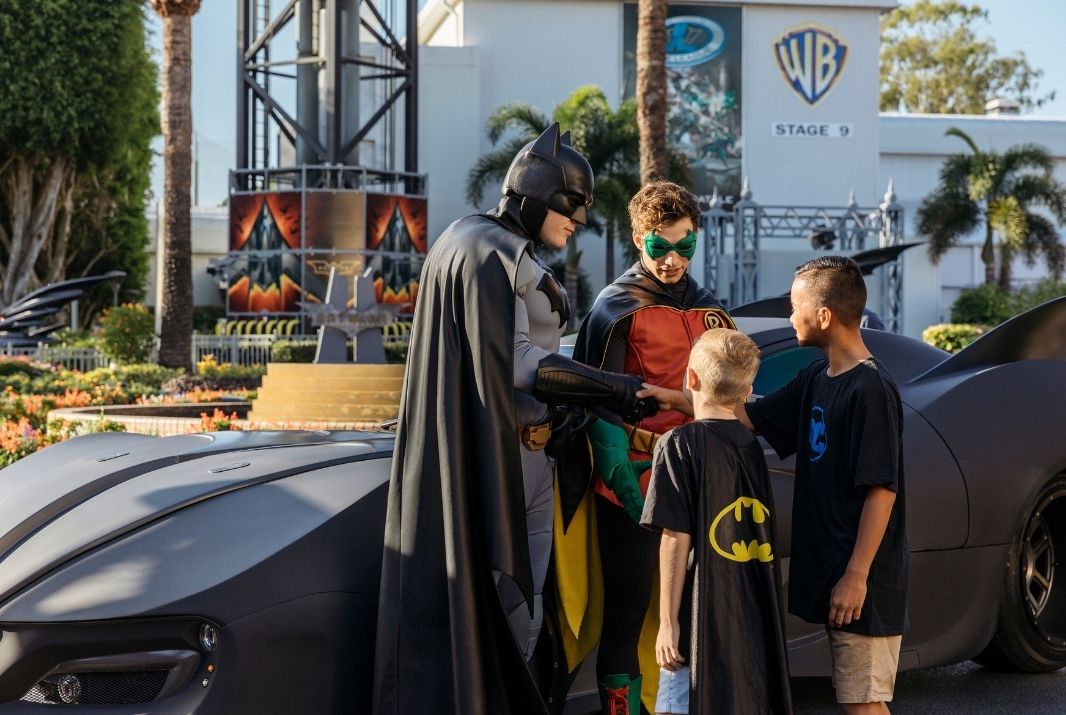 Batman & Robin meeting two fans at Warner Bros. Movie World