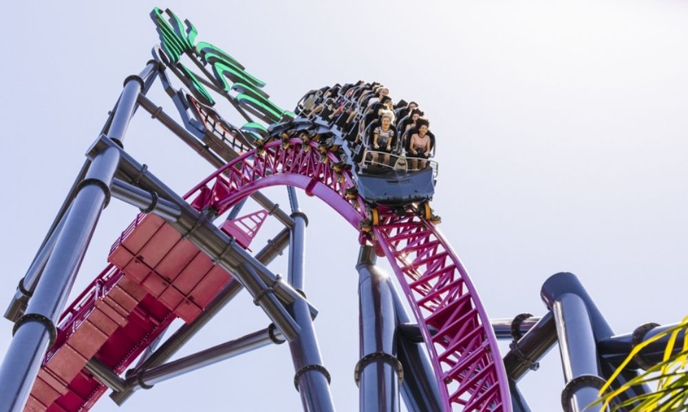 Riders race down an incline on the DC Hypercoaster at Movie World