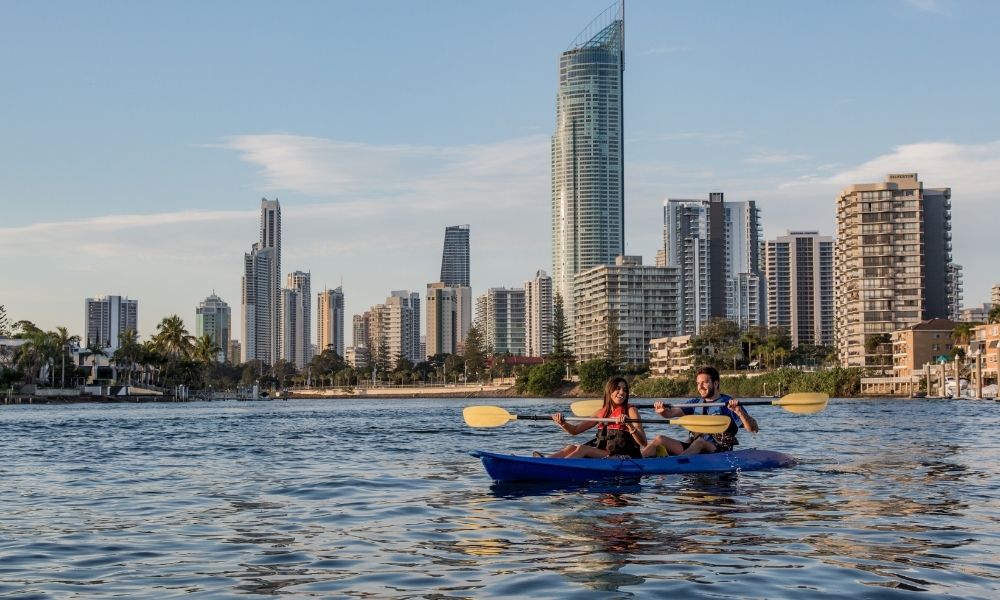 Couple take a gentle kayak tour through Surfers Paradise