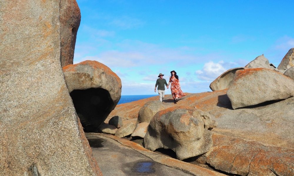 Couple walking the Remarkable Rocks on Kangaroo Island