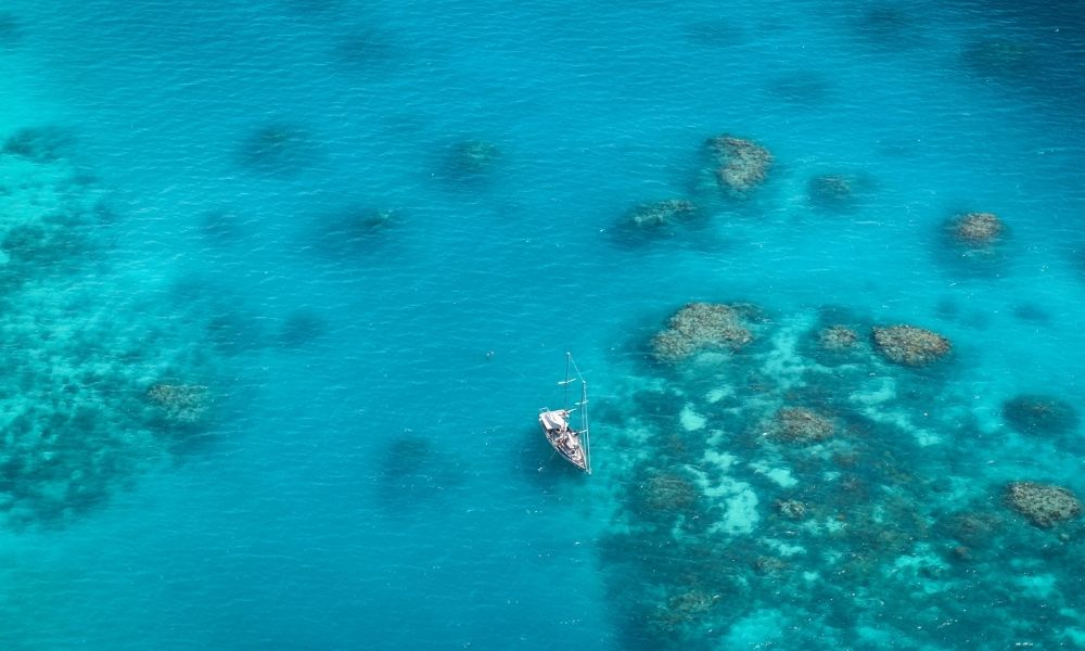 Aerial shot of a Great Barrier Reef sailing cruise