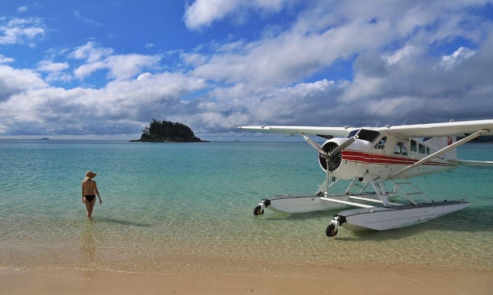 Woman taking a swim after a Whitsundays Seaplane Flight Landing