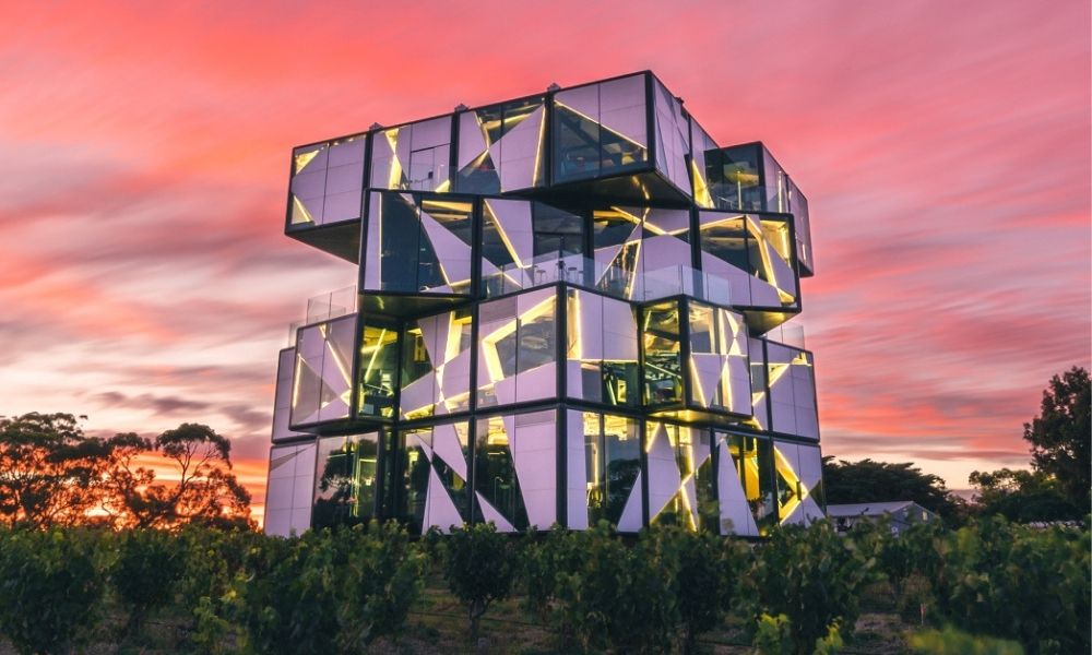 Cube shaped building set against a pink sunset