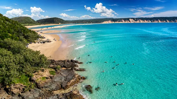 Learn To Surf Australia's Longest Wave at Double Island Point Departing Noosa