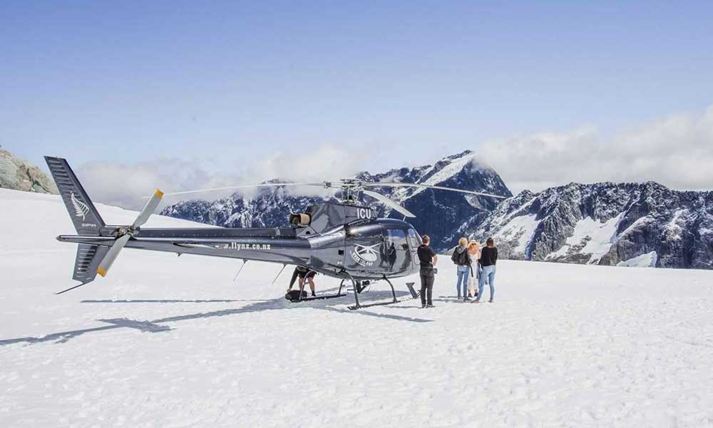 Helicopter Flight with Alpine Snow Landing 