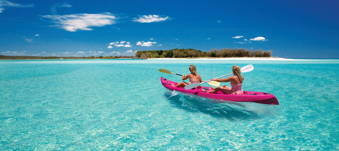 Two woman kayaking around Fraser Island