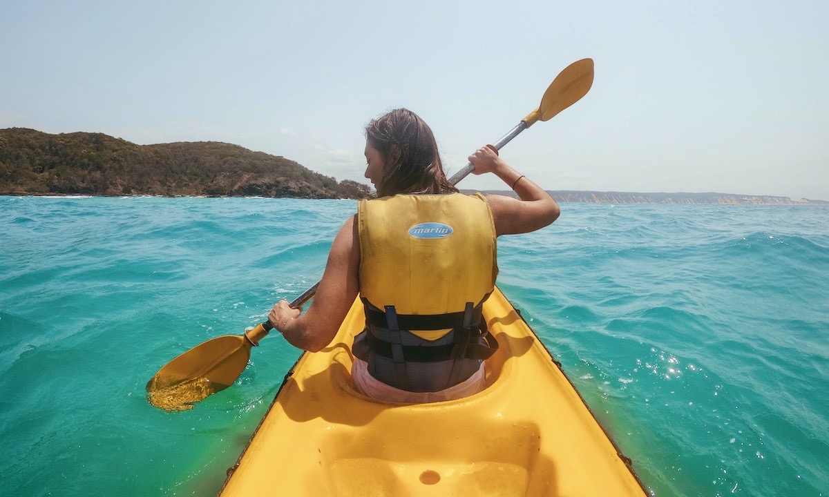 Woman kayaking on the Sunshine Coast
